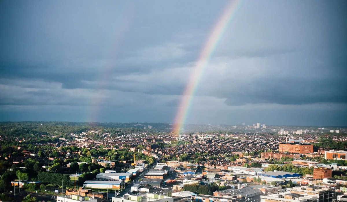 View across the rooftops of Leeds and West Yorkshire under a broken sky