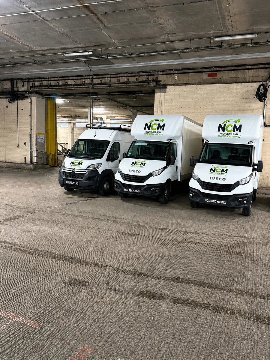 Three NCM Recycling and Waste Solutions branded Luton vans parked ready for clearance work